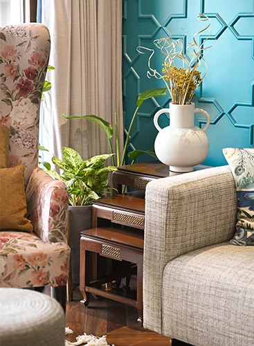 An elegant hall room featuring a comfortable sofa set with plush cushions and a coffee table