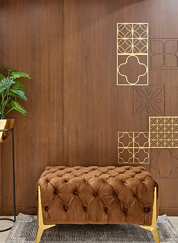 An elegantly decorated wall at 7 Nirvana, featuring a mix of artwork, framed photographs, and stylish furniture