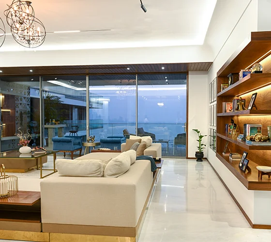 A tastefully decorated living room with elegant furniture, soft color palette, and abundant natural light