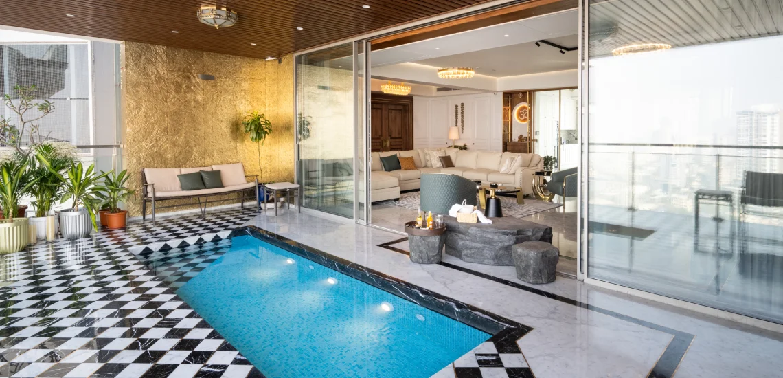 a modern apartment pool featuring a stylish checkered floor, reflecting contemporary design and elegance.